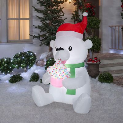 Gemmy Animated Christmas Airblown Inflatable Nom Nom Polar Bear with Cupcake  5.5 ft Tall  Multicolored Image 1