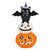 National Tree Company 22 in. Pre-Lit Bat Standing on Pumpkins Image 1