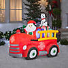 National Tree Company 6 ft. Inflatable Santa in Vintage Firetruck Image 1
