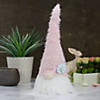 Northlight 16" pink and white spring and easter gnome table top head with a blue flower Image 1