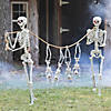 Small Skeletons Held Hostage By Large Skeletons Halloween Decorating Kit - 6 Pc. Image 1