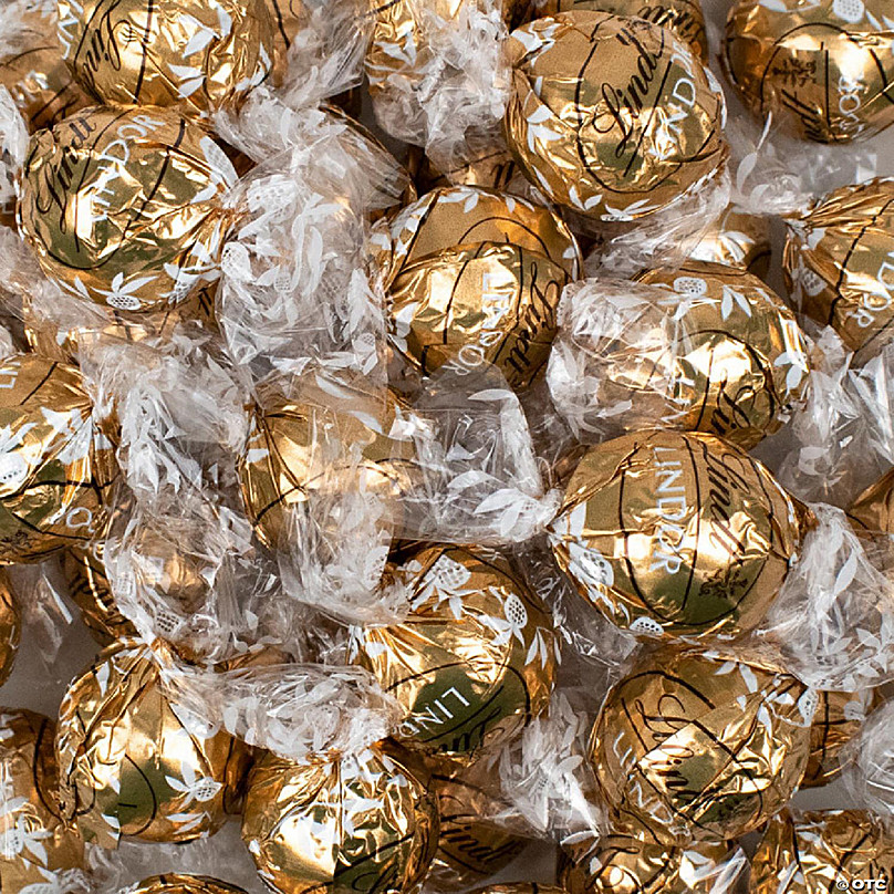 Box Of Round Candies Wrapped Into Golden Foil. One Chocolate Is