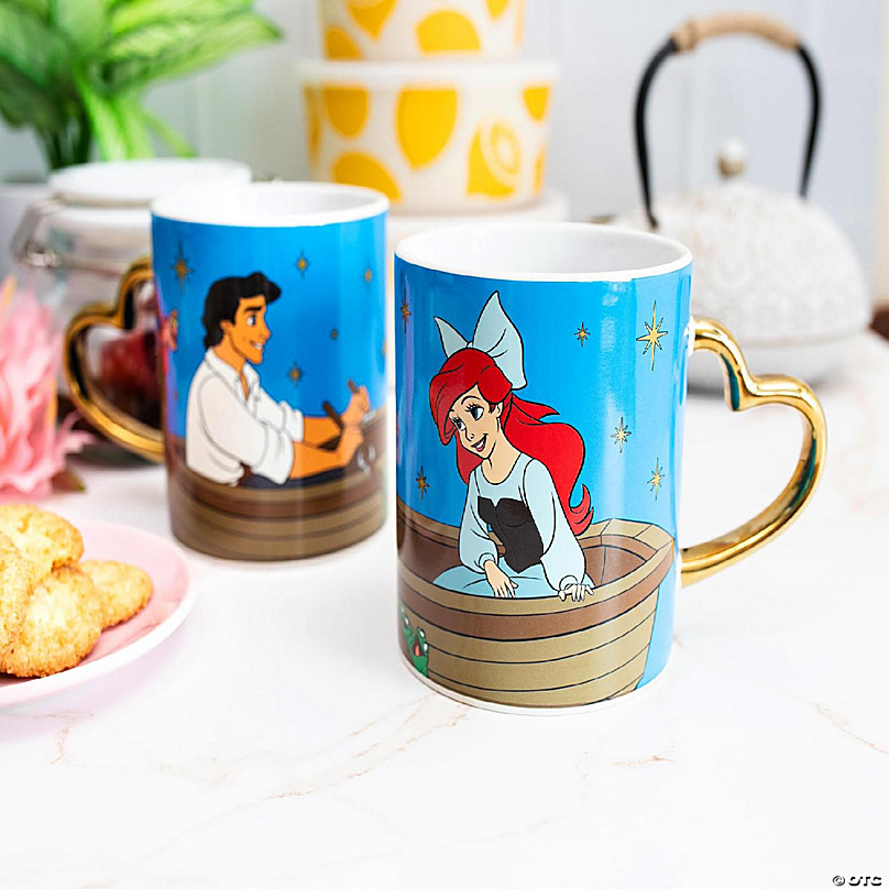 https://s7.orientaltrading.com/is/image/OrientalTrading/FXBanner_808/disney-ariel-and-eric-14-ounce-heart-shaped-handle-ceramic-mugs-set-of-2~14259843-a02.jpg