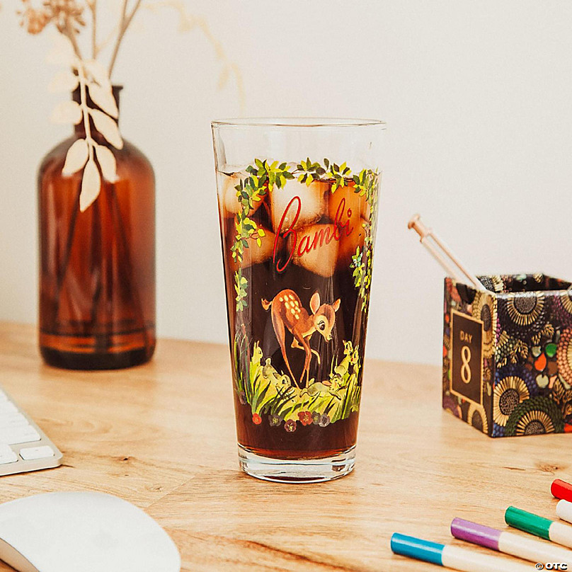 https://s7.orientaltrading.com/is/image/OrientalTrading/FXBanner_808/disney-bambi-storybook-scene-pint-glass-holds-16-ounces~14259305-a03.jpg