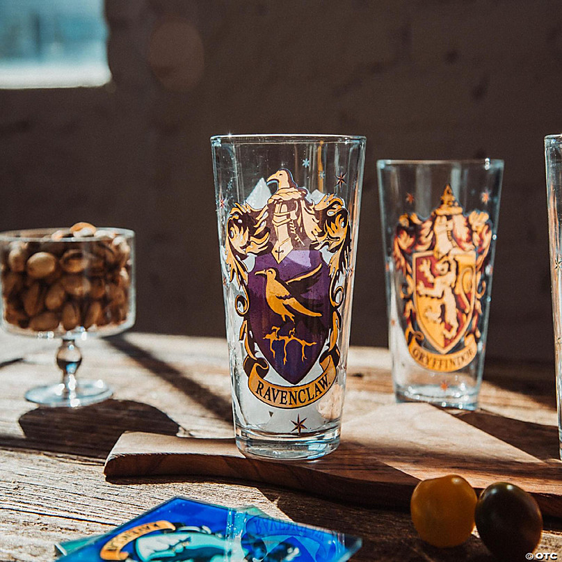 https://s7.orientaltrading.com/is/image/OrientalTrading/FXBanner_808/harry-potter-hogwarts-house-crests-16-ounce-pint-glasses-set-of-4~14332386-a03.jpg