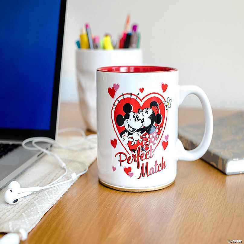 https://s7.orientaltrading.com/is/image/OrientalTrading/FXBanner_808/mickey-and-minnie-mouse-perfect-match-ceramic-coffee-mug-holds-20-ounces~14354567-a02.jpg