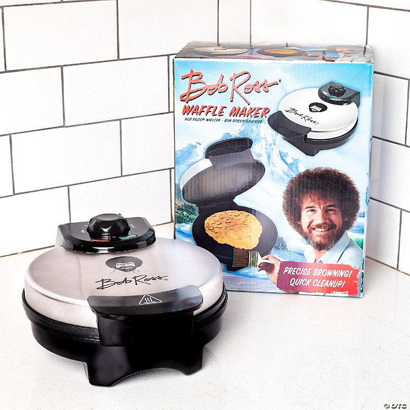 https://s7.orientaltrading.com/is/image/OrientalTrading/FXBanner_808/uncanny-brands-bob-ross-waffle-maker-bobs-iconic-face-on-your-waffles-waffle-iron~14226669-a03.jpg