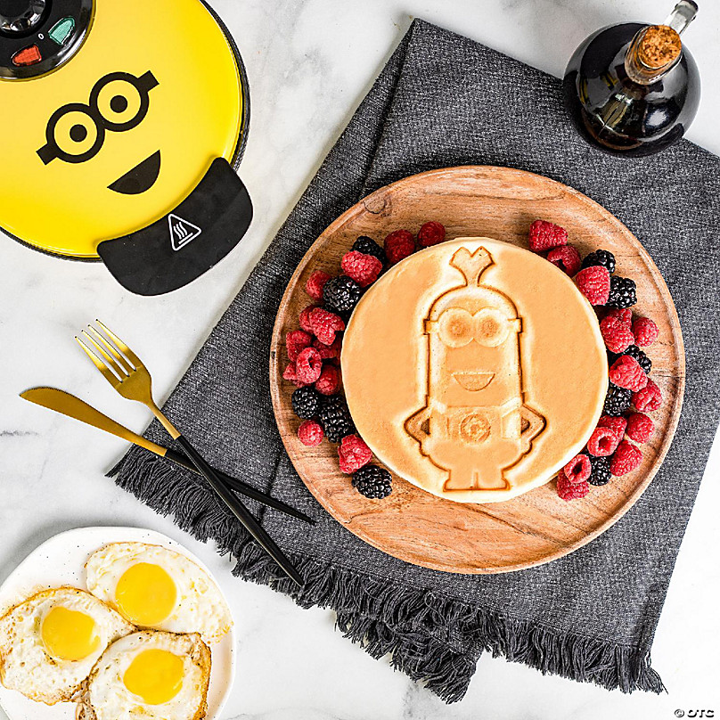 https://s7.orientaltrading.com/is/image/OrientalTrading/FXBanner_808/uncanny-brands-minions-kevin-waffle-maker-iconic-minion-on-your-waffles~14226678-a03.jpg