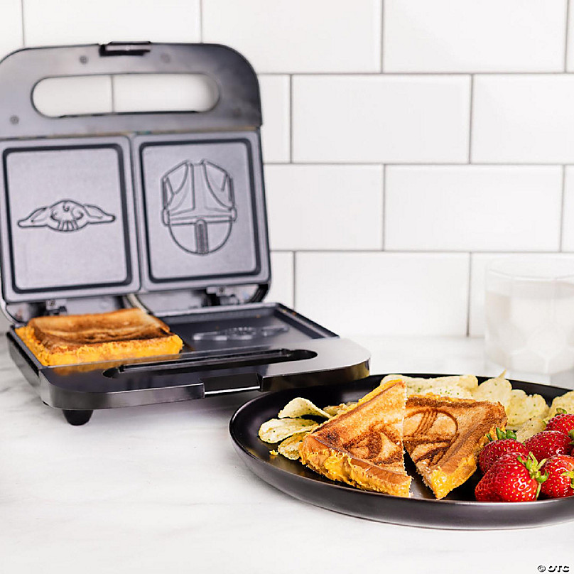 https://s7.orientaltrading.com/is/image/OrientalTrading/FXBanner_808/uncanny-brands-the-mandalorian-grilled-cheese-maker-panini-press-and-compact-indoor-grill-baby-yoda-and-mando-sandwich~14226683-a02.jpg