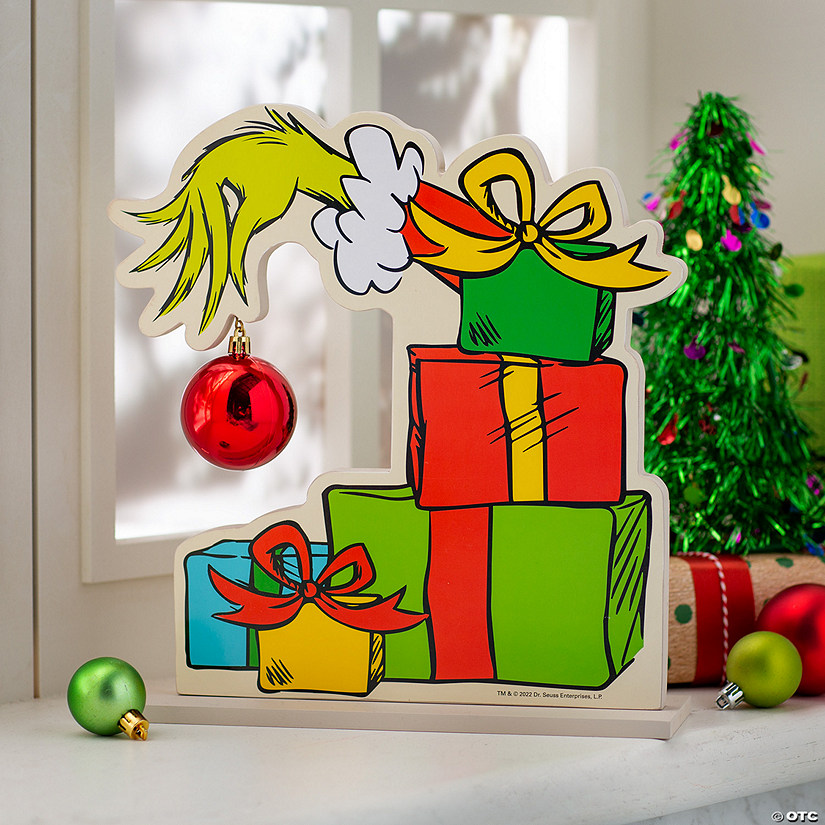 Dr. Seuss&#8482; The Grinch Hand with Ornament Christmas Tabletop Decoration Image
