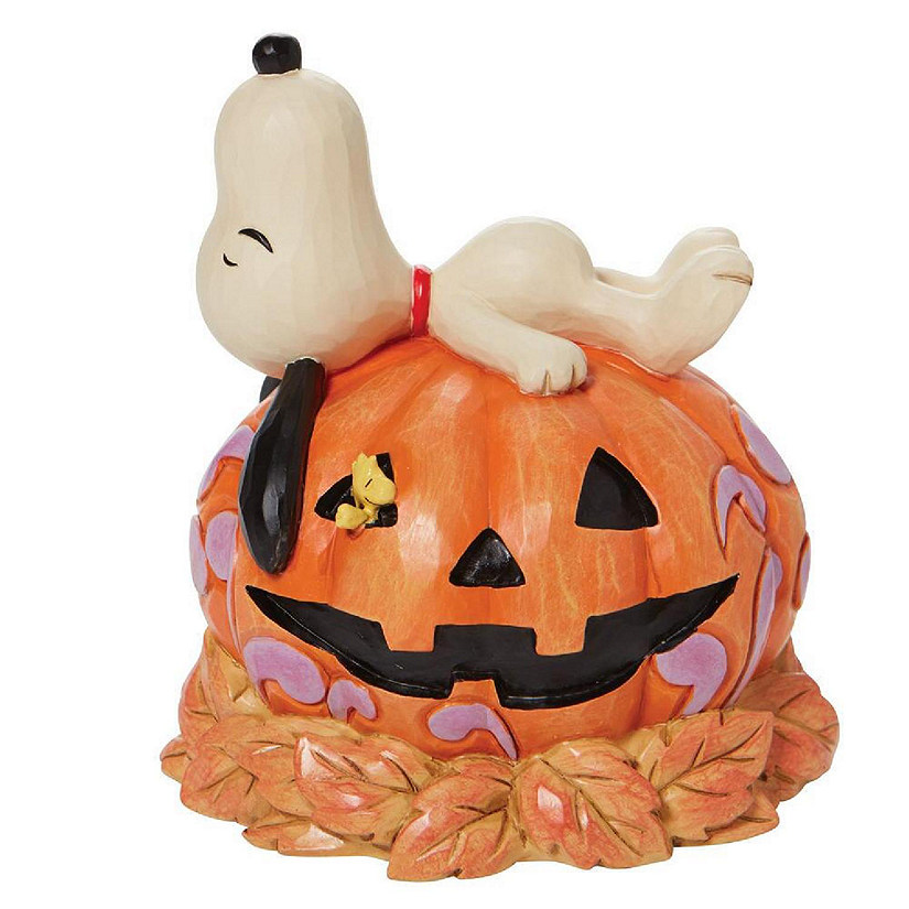 Jim Shore Peanuts Snoopy Laying on Top of Orange Carved