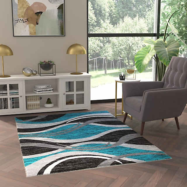 https://s7.orientaltrading.com/is/image/OrientalTrading/PDP_VIEWER_IMAGE_MOBILE$&$NOWA/emma-oliver-olefin-accent-rug-modern-abstract-wave-design-in-turquoise-gray-black-and-white-5x7-moisture-and-stain-resistant-jute-backing~14316233-a01$NOWA$