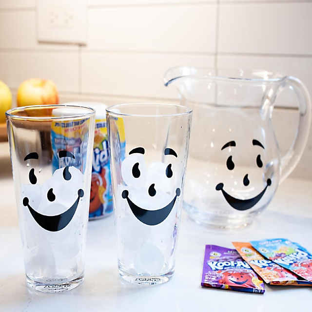 https://s7.orientaltrading.com/is/image/OrientalTrading/PDP_VIEWER_IMAGE_MOBILE$&$NOWA/kool-aid-man-64-ounce-glass-pitcher-and-two-16-ounce-pint-glasses~14257669-a01$NOWA$
