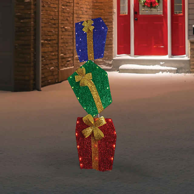 https://s7.orientaltrading.com/is/image/OrientalTrading/PDP_VIEWER_IMAGE_MOBILE$&$NOWA/northlight-4-led-pre-lit-tinsel-stacked-gift-boxes-outdoor-christmas-decoration~14124161-a01