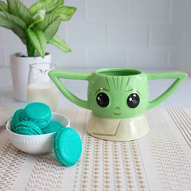 https://s7.orientaltrading.com/is/image/OrientalTrading/PDP_VIEWER_IMAGE_MOBILE$&$NOWA/star-wars-the-mandalorian-grogu-sculpted-ceramic-mug-holds-20-ounces~14260220-a01$NOWA$