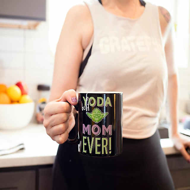 https://s7.orientaltrading.com/is/image/OrientalTrading/PDP_VIEWER_IMAGE_MOBILE$&$NOWA/star-wars-yoda-best-mom-ever-ceramic-mug-holds-20-ounces-toynk-exclusive~14343319-a01$NOWA$