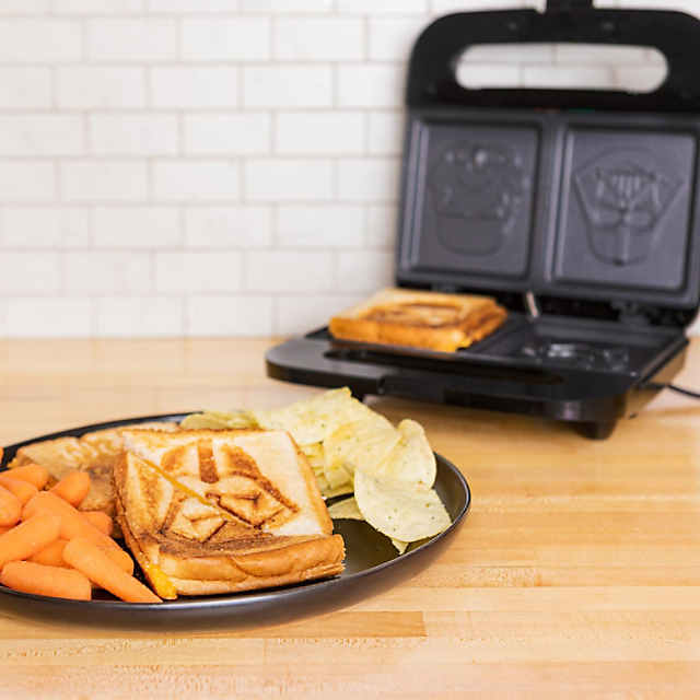 https://s7.orientaltrading.com/is/image/OrientalTrading/PDP_VIEWER_IMAGE_MOBILE$&$NOWA/uncanny-brands-star-wars-darth-vader-and-stormtrooper-grilled-cheese-maker-panini-press-and-compact-indoor-grill-opens-180-degrees-for-burgers-steaks-bacon~14226671-a01$NOWA$