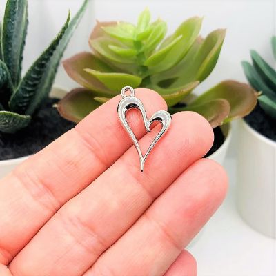 20 Pcs Silver Asymmetrical Heart Charms Image 1