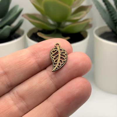 20 Pcs Small Scrolled Bronze Leaf Charms Image 1
