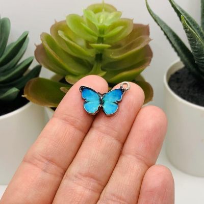 50 Pcs Aqua Blue Butterfly Charms Image 1