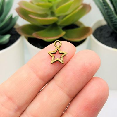 50 Pcs Bronze Open Star Charms Image 1