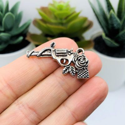 50 Pcs Silver Gun and Rose Charms Image 1