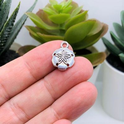 50 Pcs Silver Sand Dollar Charms Image 1