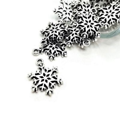 50 Pcs Silver Snowflake Christmas Charms Image 1