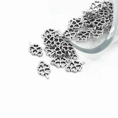 50 Pcs Tiny Lucky Clover Charms Image 1