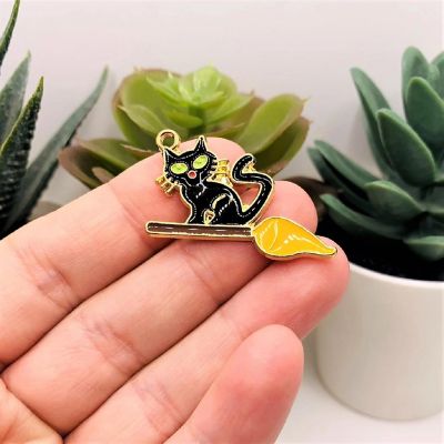 50 Pieces Black Witch Cat on Broom Charm Image 1