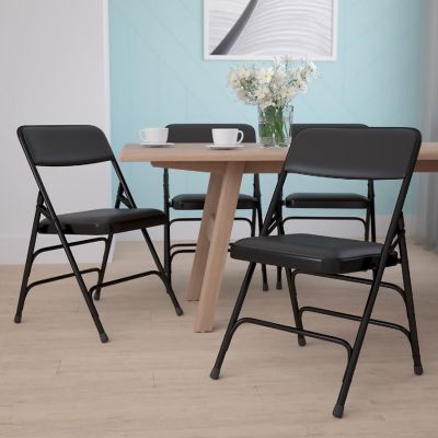 Emma + Oliver 4 Pack Curved Triple Braced Black Vinyl Metal Folding Chair Image 1