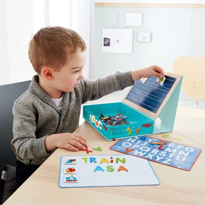 HABA Magnetic Game Box ABC Expedition - 147 Uppercase Magnetic Pieces in Cardboard Carrying Case Image 1