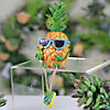 Northlight 10" Tropical Boy Pineapple with Cocktail and Dangling Legs Decoration Image 1