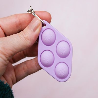 Pop Fidget Toy Purple 4-Button Silicone Keychain Accessory Image 1