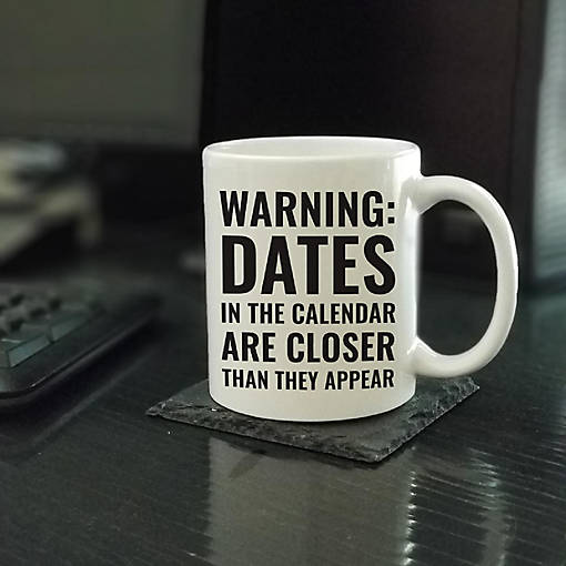 Dates Closer Than Appear ceramic mug