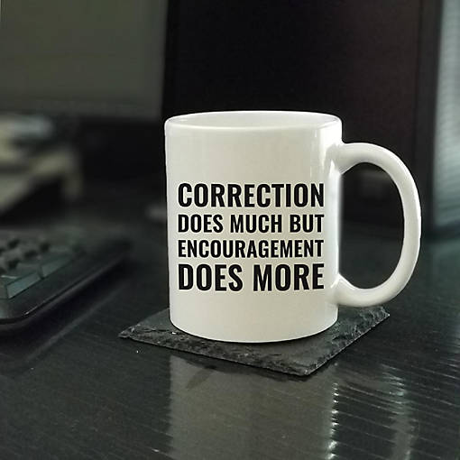 Encouragement Does More ceramic mug