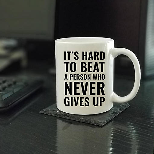 Never Gives Up Ceramic Mug